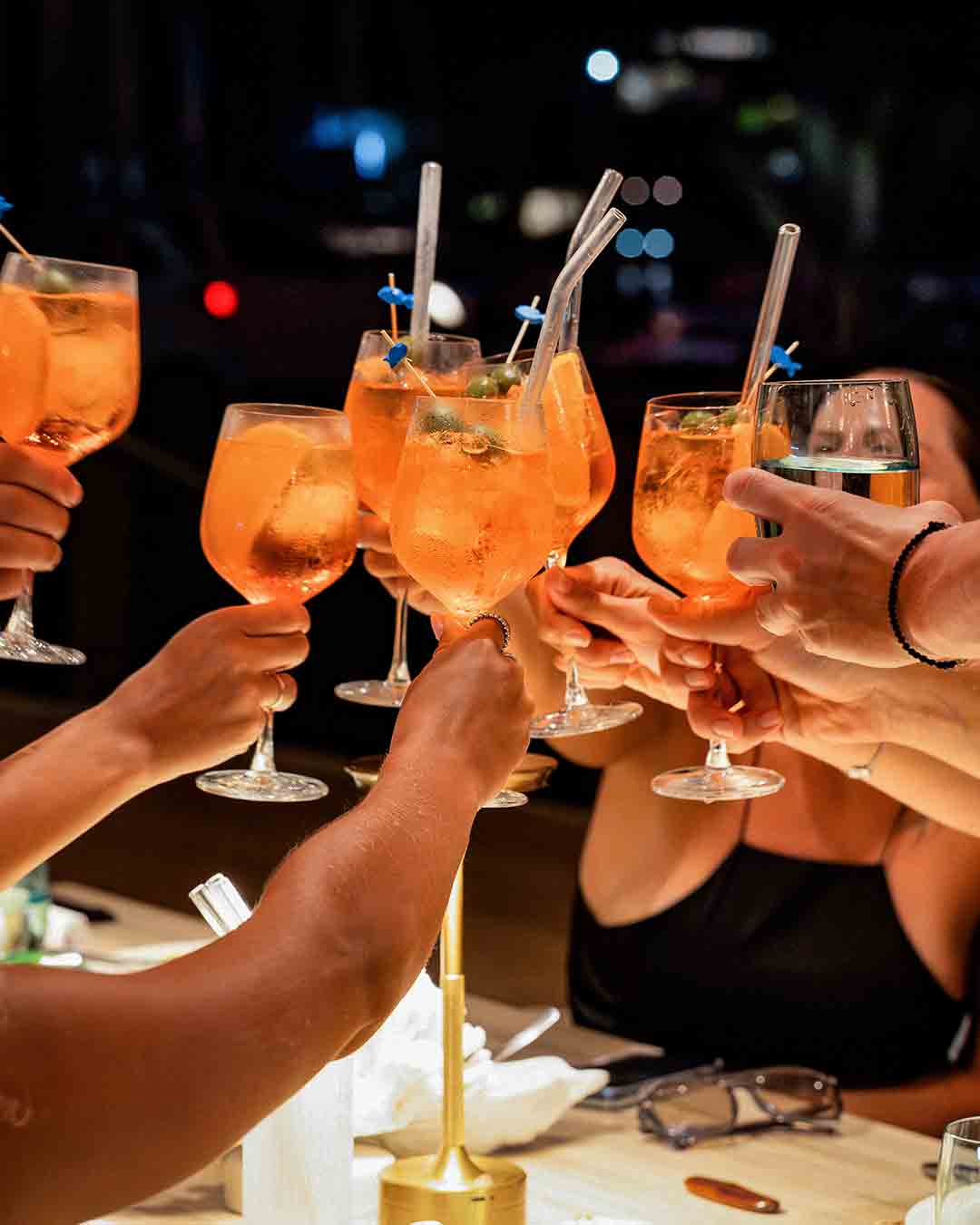 Guests enjoying cocktails at Fish& restaurant in Seychelles