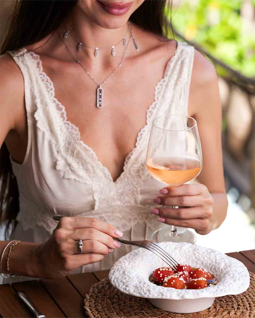 Guest enjoying wine and a tuna dish at Fish& restaurant on Eden Island