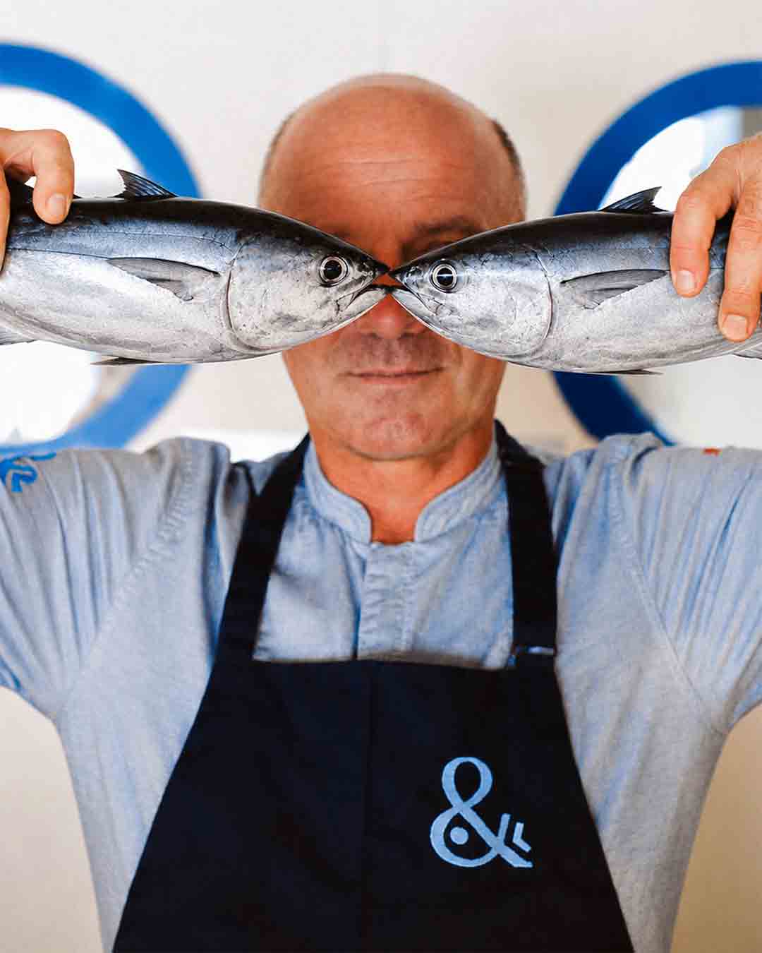 Chef presenting fresh locally sourced fish at Fish& restaurant, Eden Island