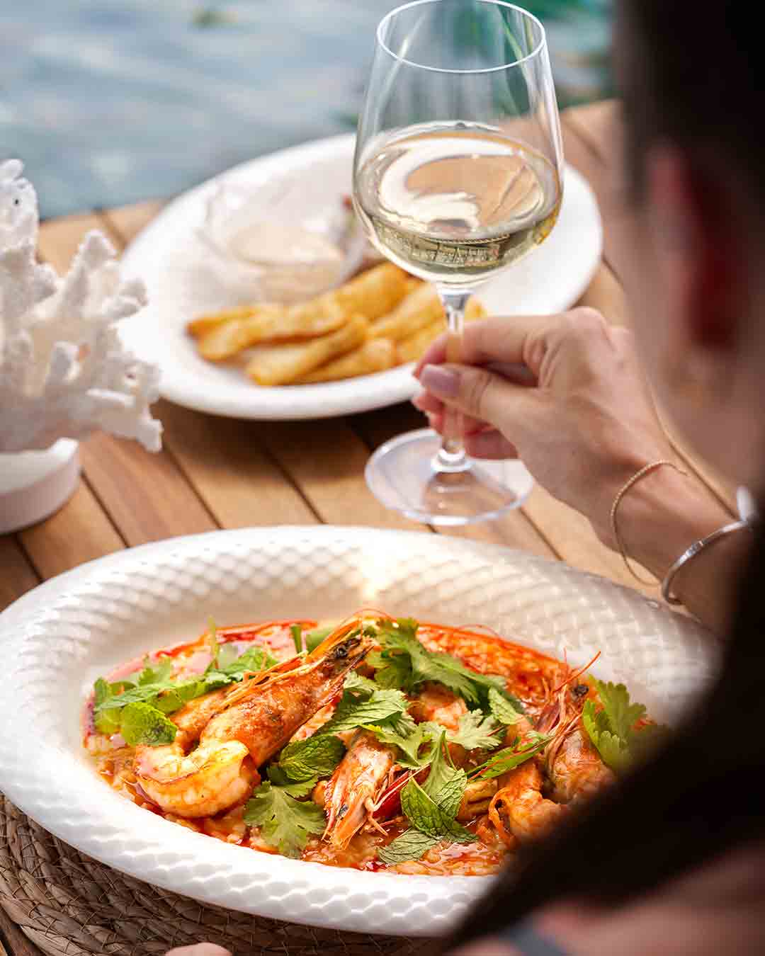 Seafood dish with prawns and wine at Fish& restaurant in Seychelles