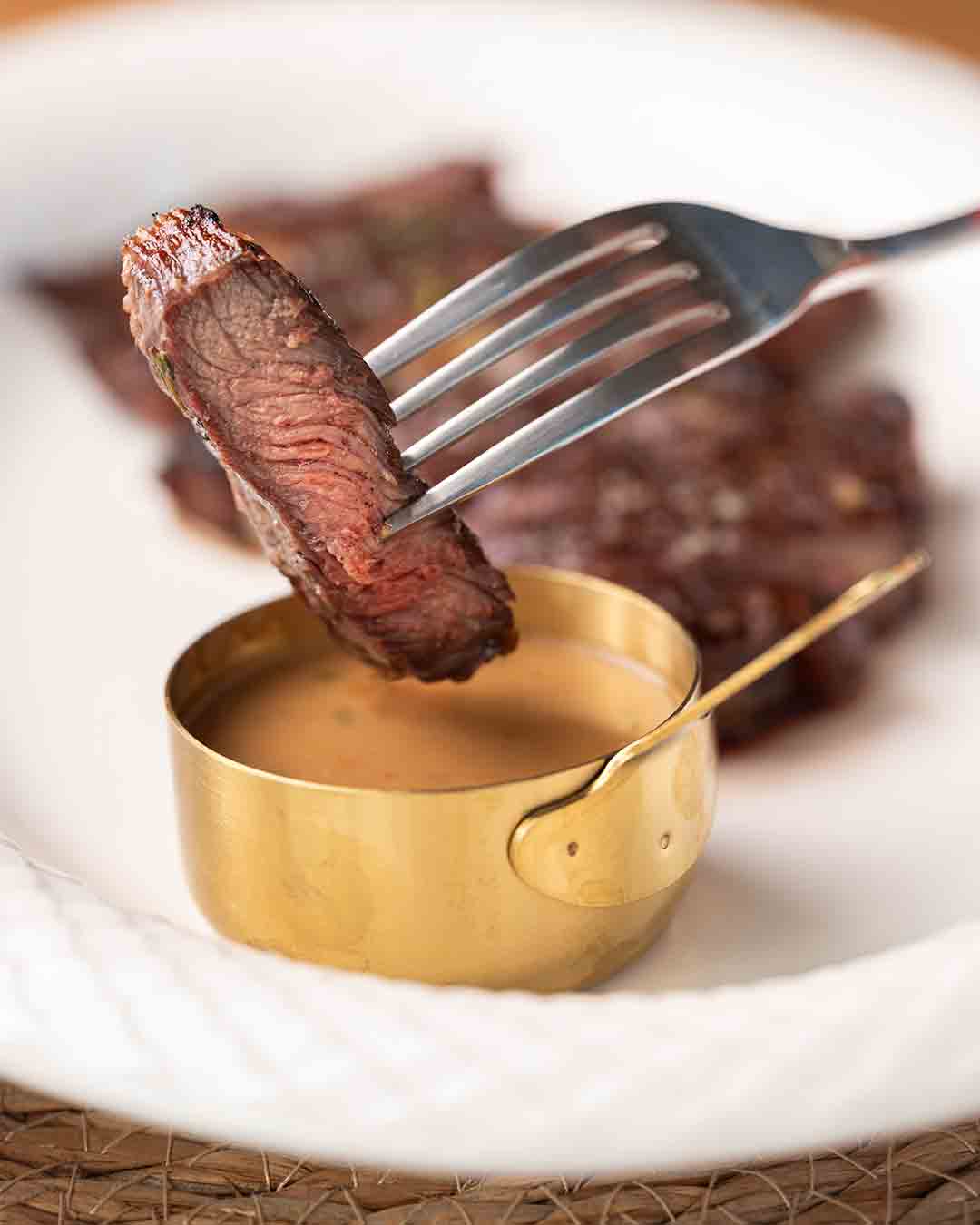 Grilled steak with sauce at Fish& restaurant in Seychelles