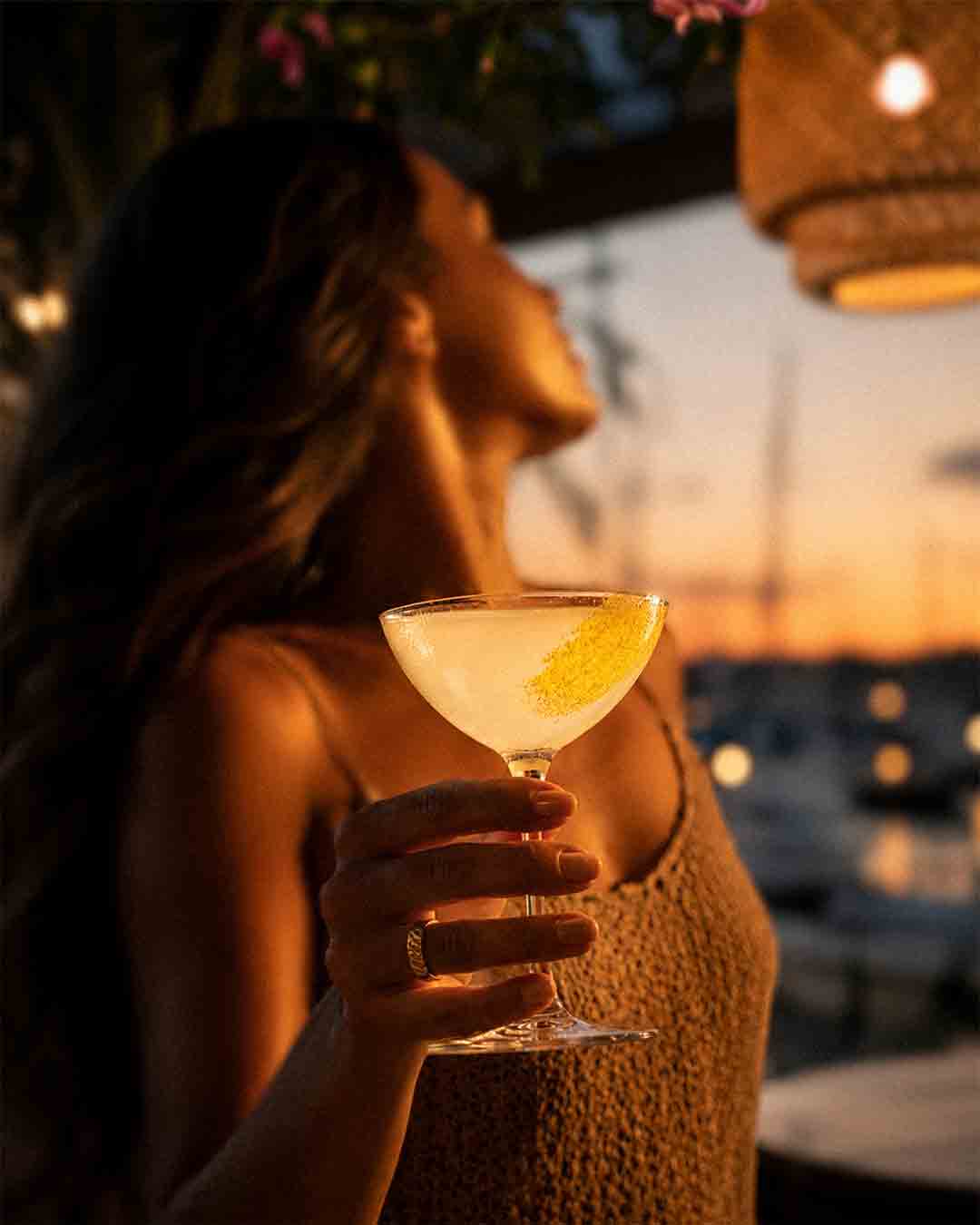 Cocktail at sunset overlooking Eden Island Marina in Seychelles